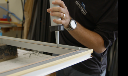 Bonding a window frame on a boat