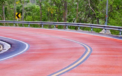 Red surfacing of a road with Sabre high friction surfacing coatings